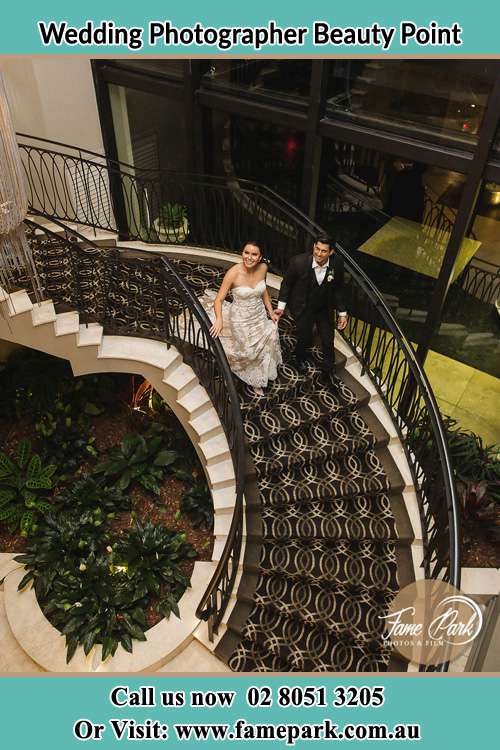 Photo of the Bride and the Groom walking down the stair Beauty Point NSW 2088