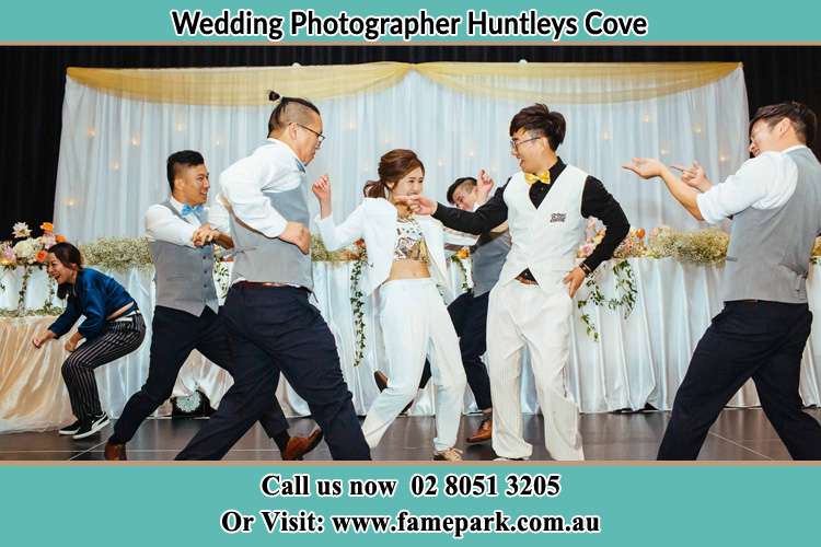 Photo of the Groom and the Bride dancing with the groomsmen on the dance floor Huntleys Cove NSW 2111