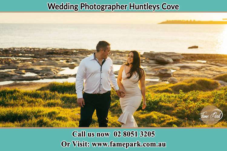 Photo of the Groom and the Bride walking near the lake Huntleys Cove NSW 2111