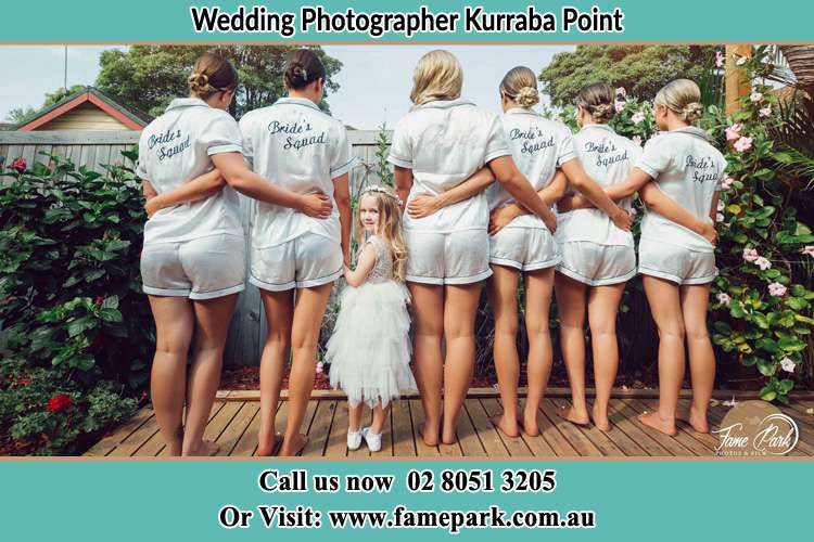 Behind photo of the Bride and the bridesmaids with the flower girl looking back Kurraba Point NSW 2089