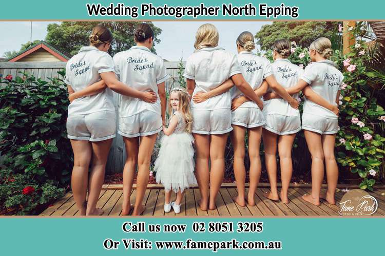 Behind photo of the Bride and the bridesmaids with the flower girl looking back North Epping NSW 2121