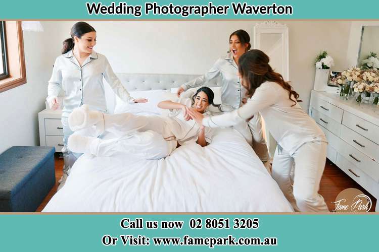 Photo of the Bride and the bridesmaids playing on bed Waverton NSW 2060