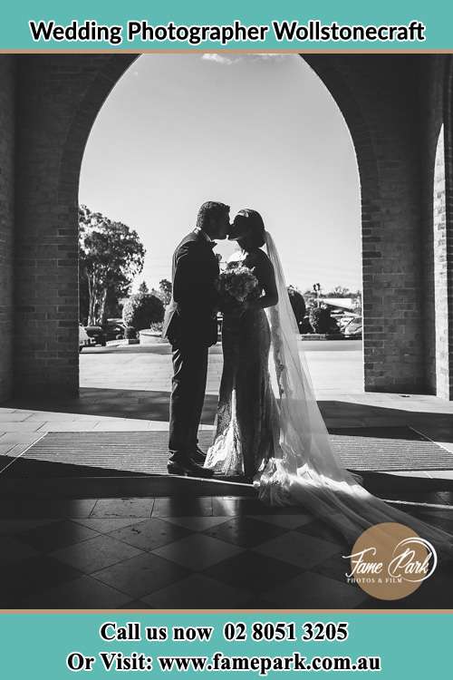 Photo of the Groom and the Bride kissing at the front of the church Wollstonecraft NSW 2065